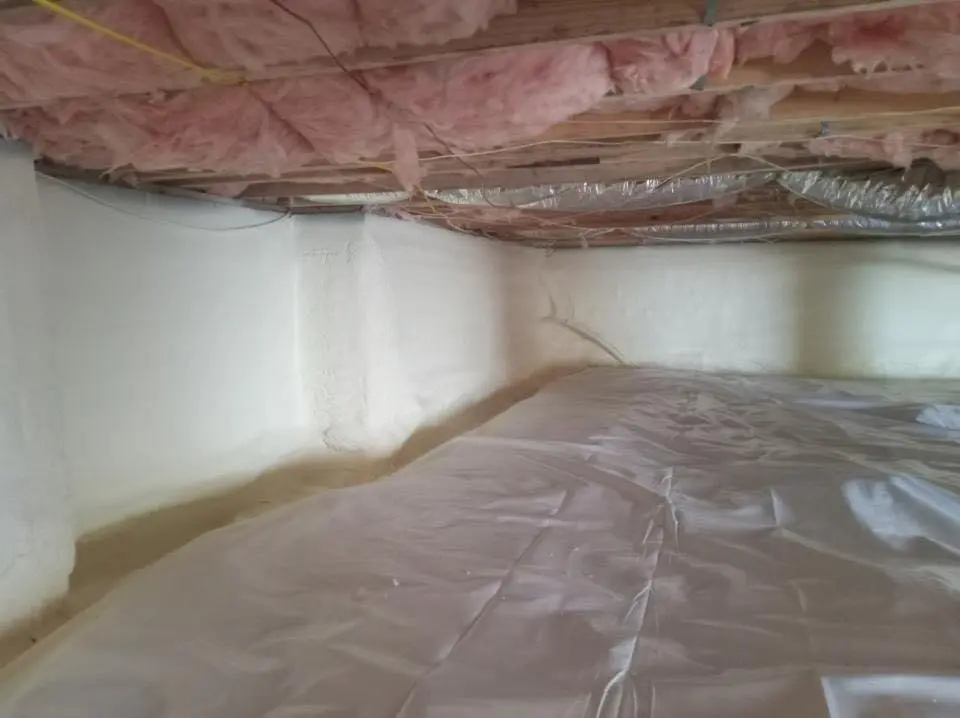 Crawl space encapsulation with closed-cell spray foam for Commercial Roof Restoration in Huntington